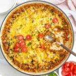 cheesy ground beef salsa rice with beans and corn in a Dutch oven.
