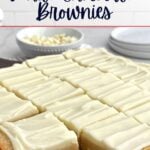 white chocolate brownies on a wooden cutting board.
