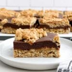 a chocolate revel bar on a white plate.