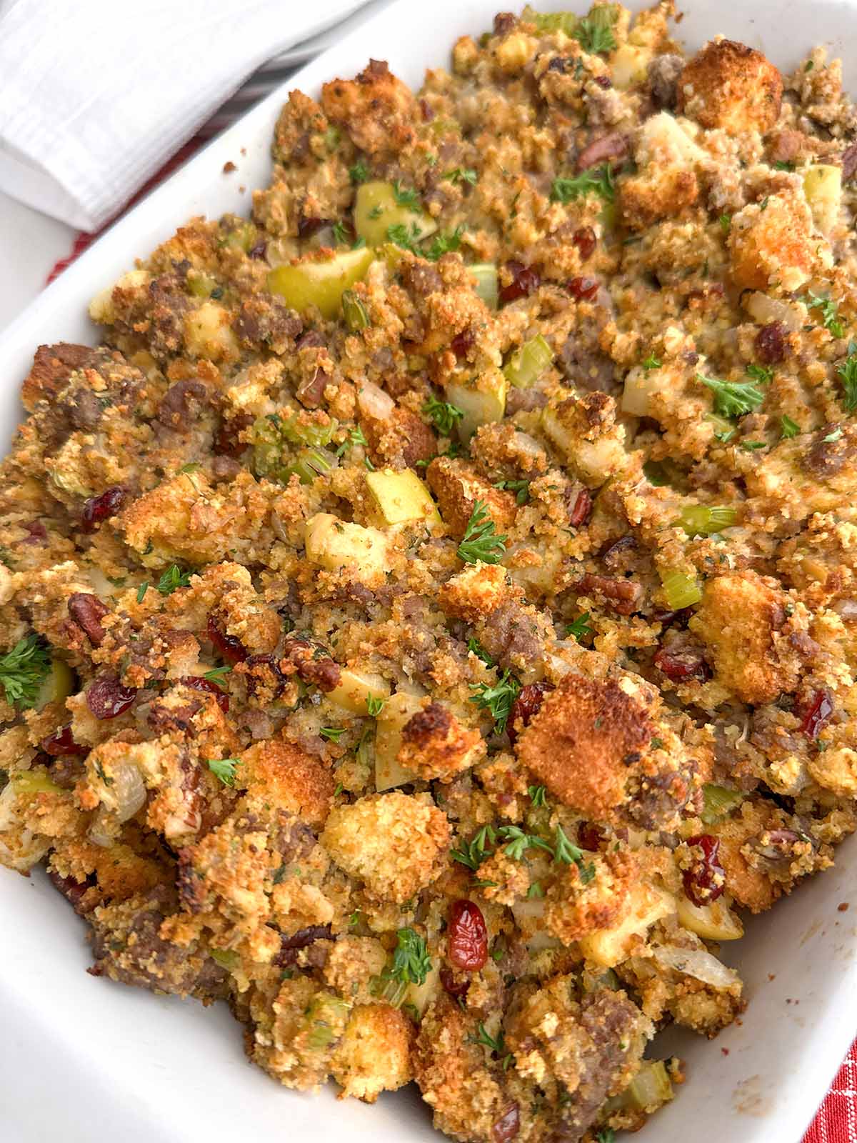 jiffy cornbread stuffing in a white baking dish.