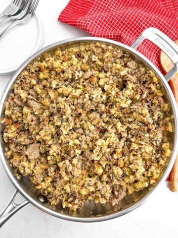wild rice stuffing in a stainless steel skillet.