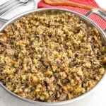 wild rice stuffing in a stainless steel skillet.