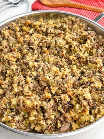 wild rice stuffing in a stainless steel skillet.