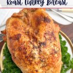 roast bone-in turkey breast on a white plate.