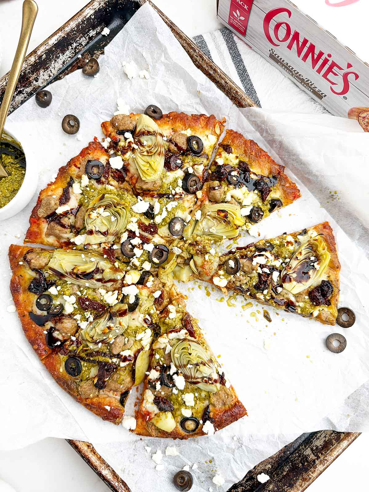 Mediterranean pizza made with a frozen sausage pizza.