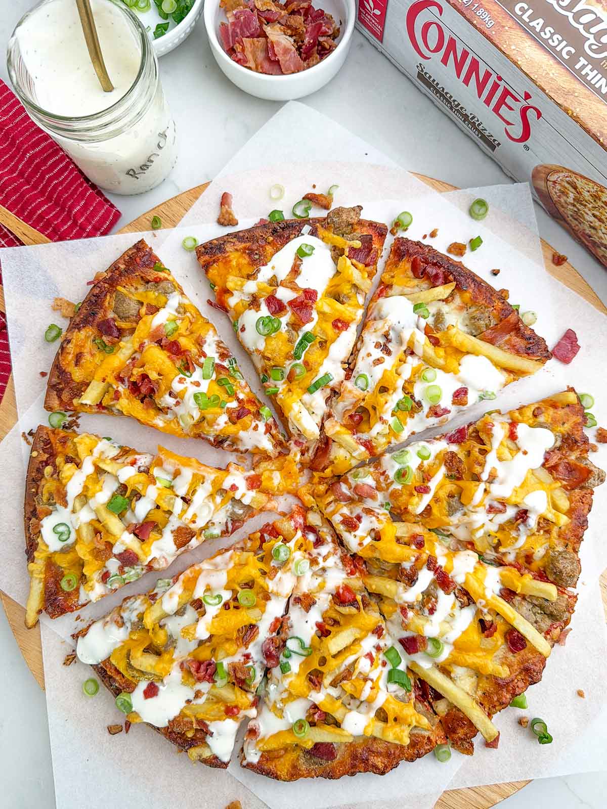 loaded fries pizza made with a frozen sausage pizza.