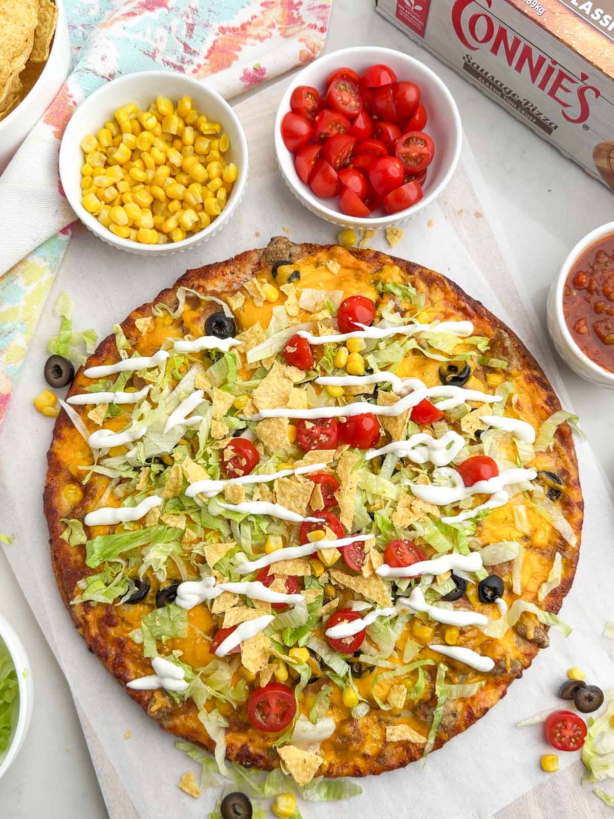 taco pizza made with a frozen sausage pizza.