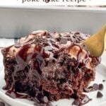 piece of chocolate poke cake on a white plate.
