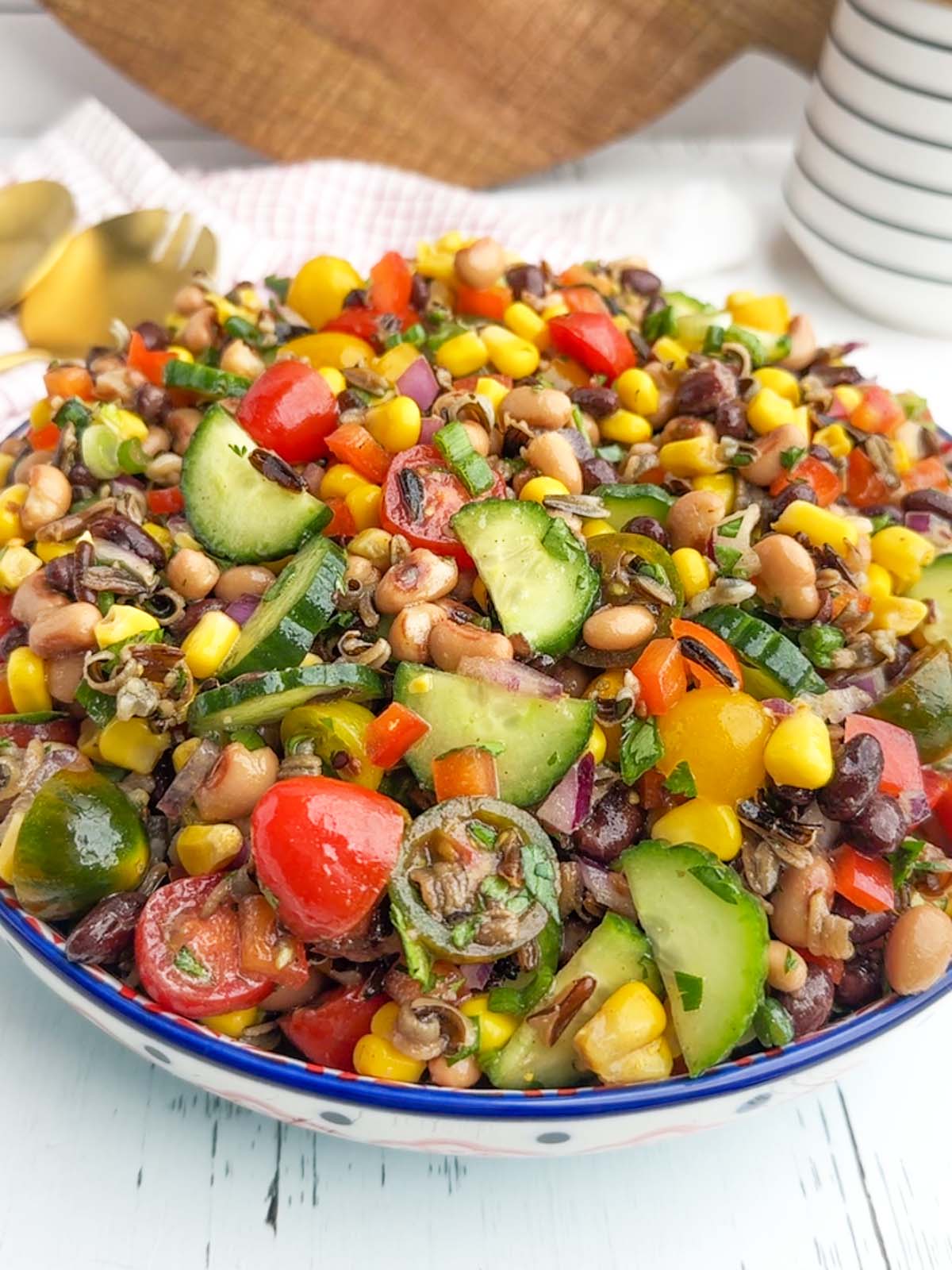 corn and wild rice salad in a white bowl.